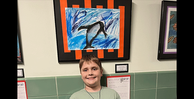 Student with his Artwork