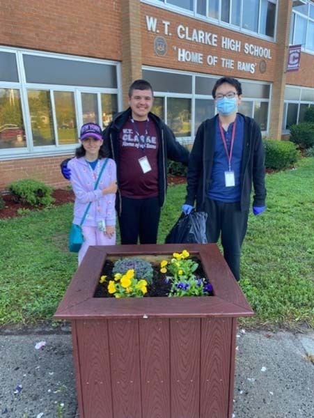 W.T. Clarke High School students plant vibrant, colorful flowers