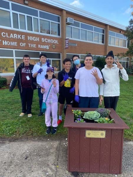 W.T. Clarke High School students plant vibrant, colorful flowers