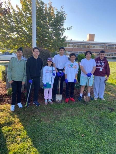 W.T. Clarke High School students plant vibrant, colorful flowers