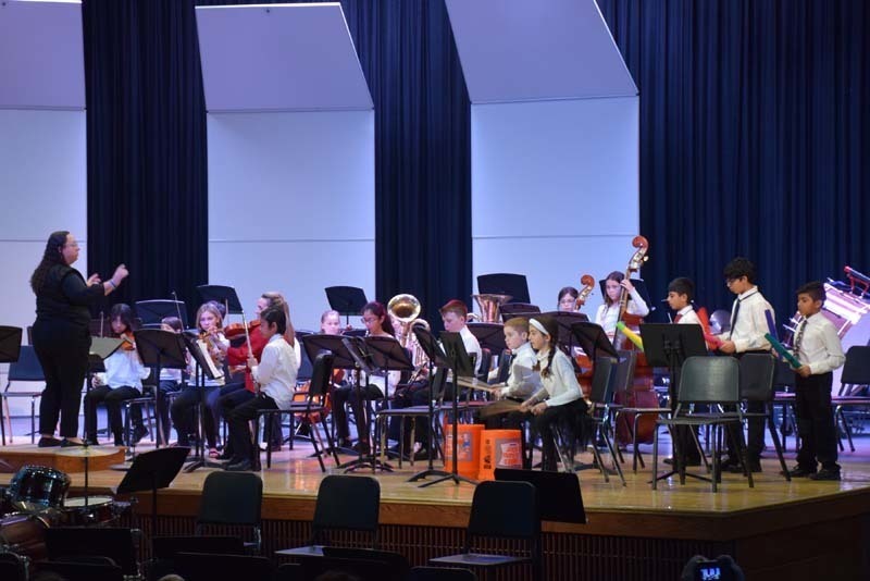 Musicians perform in the auditorium