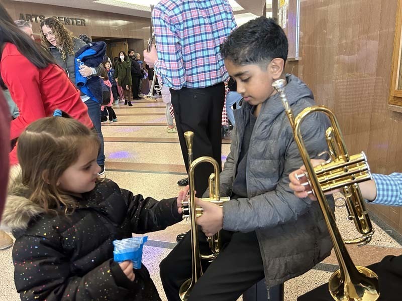 Students looking at instruments