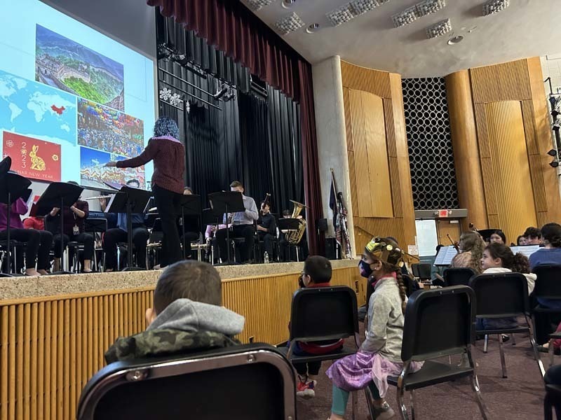 Students listening to music being played