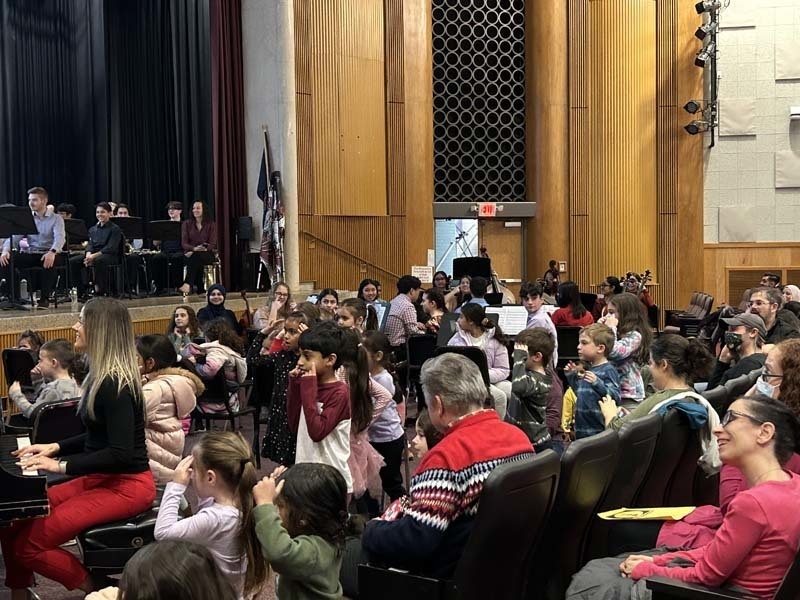 Students listening to music being played