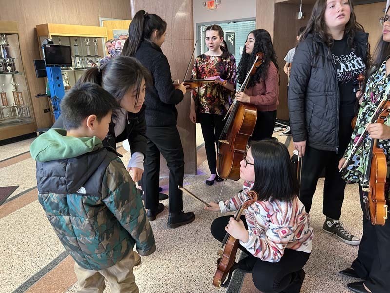 Students holding instruments