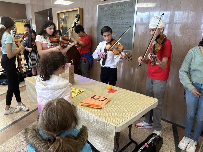 Students playing violins