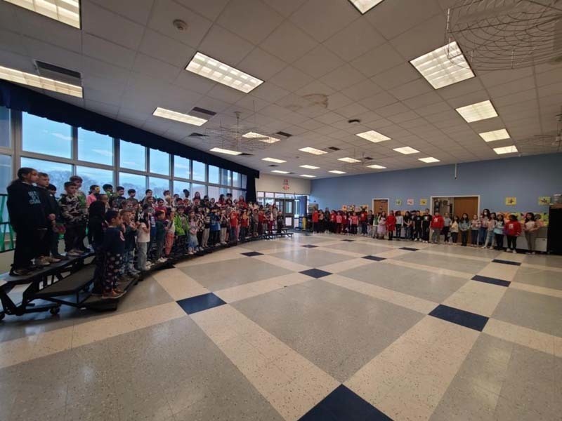 Students performing while standing on risers