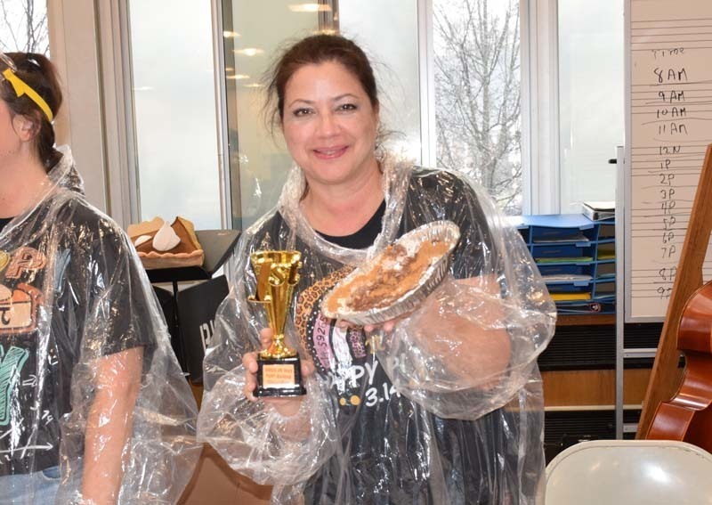 Teacher holding a pie