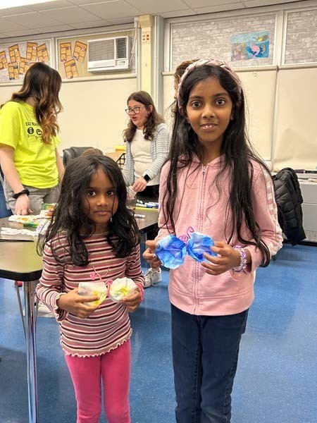 Two students smiling at the camera