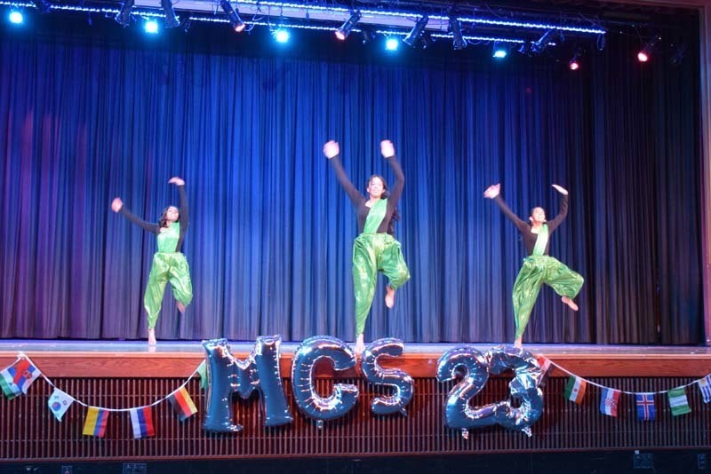 Students performing on a stage