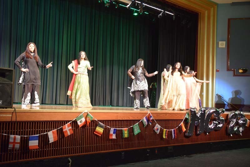 Students performing on a stage