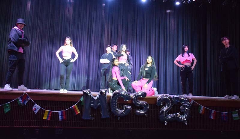 Students performing on a stage