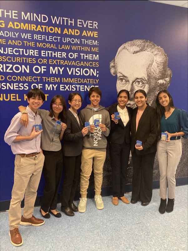 Seven W.T. Clarke High School students earned medals in the annual Al Kalfus Long Island Math Fair at Hofstra University. 