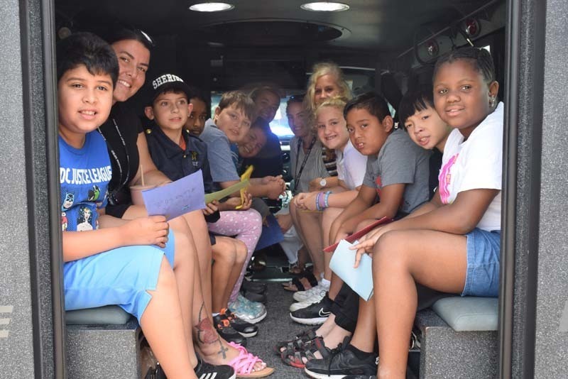 From armored vehicles to police horses, the Nassau County Police Department held a fun, interactive presentation for students in the East Meadow School District’s Extended School Year program on Aug. 3.   Members of the NCPD lined up trucks, motorcycles and cars near Bowling Green Elementary School’s main entrance as students learned about police officers and their day-to-day duties. In addition to touring the police cars and armored vehicles, students also got a hands-on experience about some of the NCPD’s equipment. Additionally, they shared thank-you cards with the police department to show gratitude for their local officers.   The district thanks the Nassau County Police Department for taking time to educate the students on their daily tasks and responsibilities. 