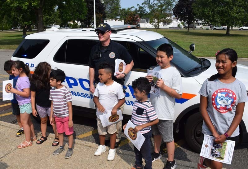 From armored vehicles to police horses, the Nassau County Police Department held a fun, interactive presentation for students in the East Meadow School District’s Extended School Year program on Aug. 3.   Members of the NCPD lined up trucks, motorcycles and cars near Bowling Green Elementary School’s main entrance as students learned about police officers and their day-to-day duties. In addition to touring the police cars and armored vehicles, students also got a hands-on experience about some of the NCPD’s equipment. Additionally, they shared thank-you cards with the police department to show gratitude for their local officers.   The district thanks the Nassau County Police Department for taking time to educate the students on their daily tasks and responsibilities. 