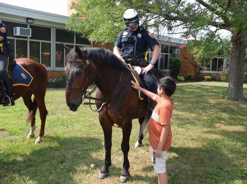 From armored vehicles to police horses, the Nassau County Police Department held a fun, interactive presentation for students in the East Meadow School District’s Extended School Year program on Aug. 3.   Members of the NCPD lined up trucks, motorcycles and cars near Bowling Green Elementary School’s main entrance as students learned about police officers and their day-to-day duties. In addition to touring the police cars and armored vehicles, students also got a hands-on experience about some of the NCPD’s equipment. Additionally, they shared thank-you cards with the police department to show gratitude for their local officers.   The district thanks the Nassau County Police Department for taking time to educate the students on their daily tasks and responsibilities. 