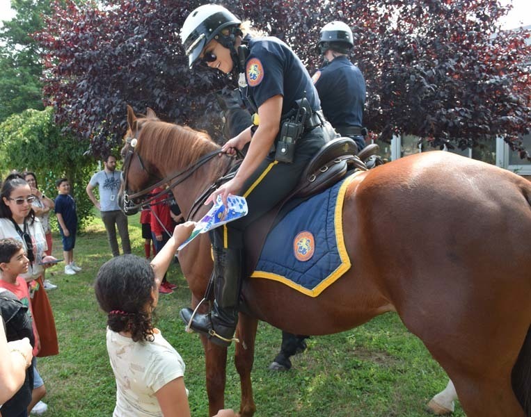 From armored vehicles to police horses, the Nassau County Police Department held a fun, interactive presentation for students in the East Meadow School District’s Extended School Year program on Aug. 3.   Members of the NCPD lined up trucks, motorcycles and cars near Bowling Green Elementary School’s main entrance as students learned about police officers and their day-to-day duties. In addition to touring the police cars and armored vehicles, students also got a hands-on experience about some of the NCPD’s equipment. Additionally, they shared thank-you cards with the police department to show gratitude for their local officers.   The district thanks the Nassau County Police Department for taking time to educate the students on their daily tasks and responsibilities. 